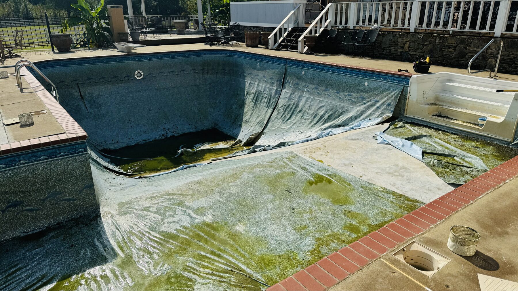 Pool with its old liner partly removed